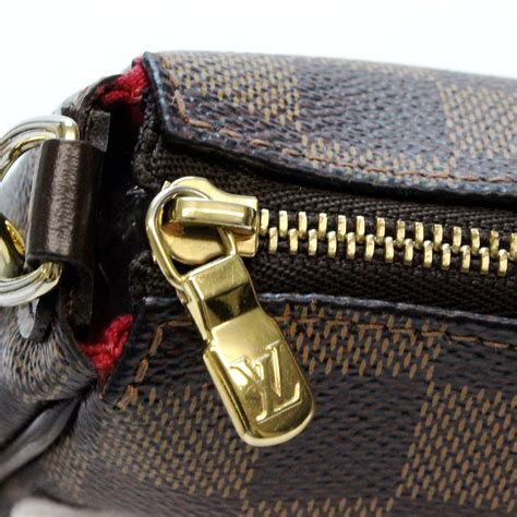 lv eva clutch damier ebene|eva clutch for sale.